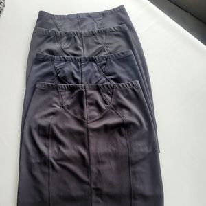 4 Black stretch slimming skirts